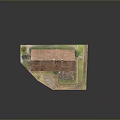 Scenic Historical Stone Building with Red Roof Small Annex and Green Grass