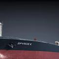 Large Cargo Ship Navigating On Open Sea With Red And Black Hull
