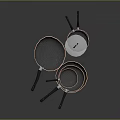 Copper Kitchen Cookware Set with Black Handles Stacked Frying Pans And Egg In Pan