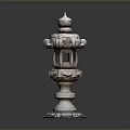 Traditional Japanese Stone Lantern With Carved Details And Decorative Garden Structure