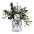 Elegant Decorative Flower Arrangement In Transparent Glass Vase With White Flowers And Green Leaves