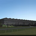Modern Industrial Factory Building With Large Glass Curtain Walls Surrounding Greenery Lawn And Bushes