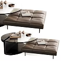 Modern Coffee Table With Glass Top And Leather Ottoman Featuring Magazines And Decorative Items