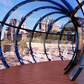 Seaside Viewing Platform With Transparent Curved Railings Blue Sea And Distant Building