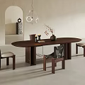 Oval Dark Wood Dining Table Set With Four Chairs Decorative Vase And Pendant Light