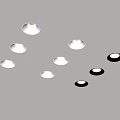 White and Black Downlights and Spotlights Arranged on Gray Background