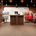 Organized Cloakroom Space Featuring Wooden Lockers Arched Mirrors And Hanging Clothes