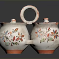 Pair of Decorative Ceramic Containers With Floral Patterns And Orange Rimmed Lids
