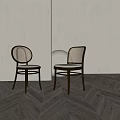 Stylish Dining Chairs With Black Frame Woven Rattan Backrest And Gray Cushion On Wooden Floor