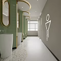 Modern Public Restroom With Green Tiles Gold Framed Mirrors White Sinks And Speckled Flooring