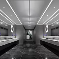 Modern Public Restroom Interior With Marble Vanities Round Mirrors Purple Flowers And Black Marble Floor