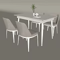 Modern Dining Table Set With White Rectangular Surface Four Gray Chairs Potted Plant Cup Book