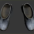 Blue Rain Boots With Worn Design And Mud On Soles On Dark Background