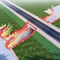 Red and Gold Winged Dragon Shaped Sculptures Along Roadside With Green Grass and Paved Areas