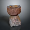 Intricate Sculptural Carving Of Decorative Vessel With Detailed Patterns On Stone Base