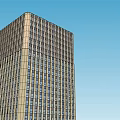 Tall Modern Office Building With Glass Facade And Blue Sky Background