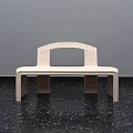 Modern Light Colored Bench With Curved Backrest On Dark Floor And Gray Wall 3d model