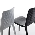 Two Modern Dining Chairs With Quilted Backrest Light And Dark Colors 3d model