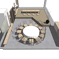 Round Wooden Tea Table With Matching Chairs In Indoor Tea Room Setting