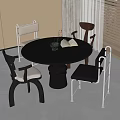 Modern Black Round Dining Table and Chairs Set In Room With Window Vase and Book