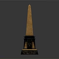 Tall Golden Topped Obelisk With Black Base And Ornate Decorative Elements