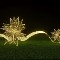 Outdoor Golden Star Art Installation With Wavy Light Strips On Green Grass At Night