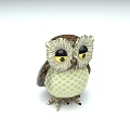 Decorative Owl Figurine With Large Round Eyes And Brown White Textured Feathers