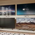 Four TVs on Wall and Stand Displaying Scenic Mountain Starry Sky Windows 10 4K UHD