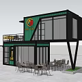 Modern Container Building Cafe With Green Black Exterior Large Windows And Outdoor Tables