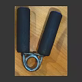 Hand Grippers Sports Equipment With Black Handles Metal Spring On Training Mat