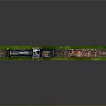 Toy Train Model With Black Steam Locomotive And Pink Car On Green Track