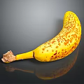 Ripe Yellow Banana with Brown Spots and Stem on Black Background with Reflection