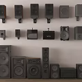 Various Headphones And Speakers In Different Sizes Wall Mounted And Floor Standing Styles