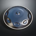Handpan Musical Percussion Instrument Dark Metallic Round Body With Central Hole And Silver Rim
