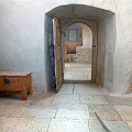 Scenic Landscape Featuring Ancient Stone Archway Stone Floor And Wooden Chest View