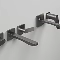 Three Black Modern Minimalist Faucets Mounted on Gray Wall Surface Design
