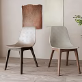 Minimalist Dining Chairs With Light Seats Dark Light Wooden Legs And Green Plant Background