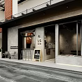 Modern Cafe With Streetfront Outdoor Seating Bar Counter And Morning Coffee Sign