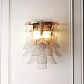 Modern Transparent Petal Design Wall Sconce With Gold Frame And Warm Lighting On White Wall