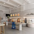 Modern Dessert Shop Interior With Open Layout Display Case And Circular Decorative Lights 3d model