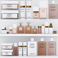 Elegant Chanel Coco Perfume And Cosmetics Collection On White Shelf