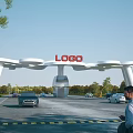 White Arched Entrance Gate With LOGO On Top Surrounded By Cars Man Trees Blue Sky