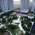 Tall modern buildings surrounding urban park with green spaces circular pathways and central structure