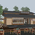 Traditional Homestay Building With Tile Roof Outdoor Seating And Natural Surroundings