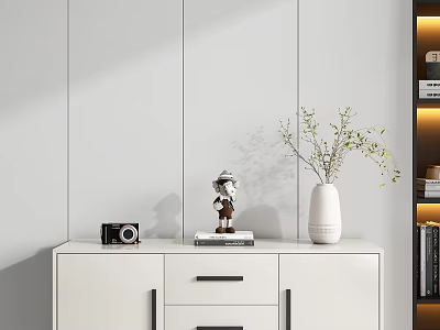 Decorative Ornament Set With Figurine Book Camera Vase And Green Foliage On White Cabinet 3d model