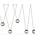 Multiple Unique Shaped Pendant Lights With Spherical Lampshades Golden Bases Suspended On White Background
