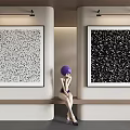 Black and White Abstract Paintings on Indoor Wall with Seated Person in Purple Hat