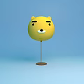 Yellow Round Ball Table Lamp With Cartoon Face And Brown Base On Light Blue Background