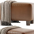 Cozy Brown Leather Stool Topped With Gray Blanket And Sturdy Wooden Legs