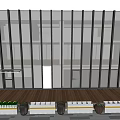 Modern School Building Featuring Glass Facade Wooden Deck And Black Pots With Green Plants